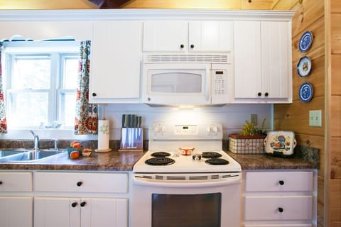 Galley style kitchen with dishwasher and Standard Drip coffeemaker.