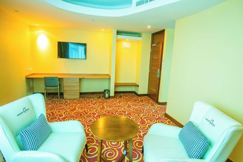 Junior Suite | Living area | 43-inch Smart TV with satellite channels