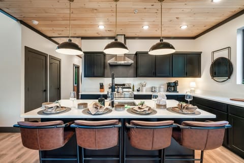 Kitchen island with additional space for serving and seating.