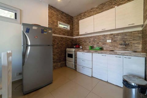 Comfort Apartment, Multiple Beds, Pool View | Private kitchen | Fridge, electric kettle, dining tables