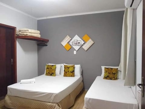 Standard Triple Room, City View | Individually decorated, laptop workspace, free WiFi, bed sheets