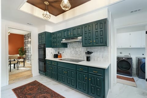Easy access to the kitchen, complete with ample cabinetry, making entertaining and dining a breeze
