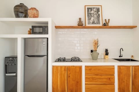 Deluxe Villa, Pool View | Private kitchenette | Fridge, microwave, stovetop, coffee/tea maker