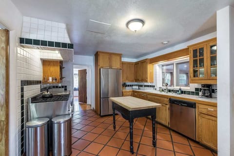 The generously sized kitchen offers plenty of space to make your meals.