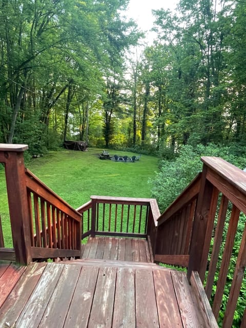 You are surrounded with privacy due to the magnificent trees. Enjoy a fire +.