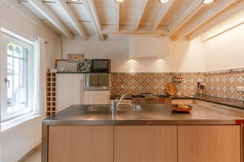 Spacious kitchen in connection to dining area