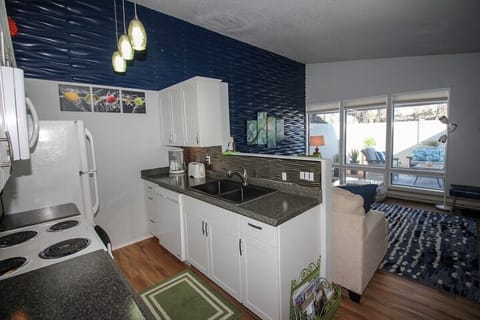 Kitchen opens to living room to visit while preparing food