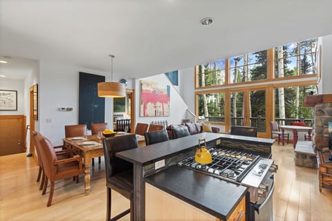 The dining Kitchen area is a spacious open space overlooking the living room with stunning views of the mountains outside.