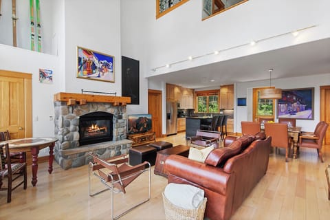 Open family room with high ceilings, gas fireplace, this space offers the perfect space for game night, family movie fun and more.