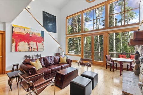 The family room features ample cozy seating, high windows that offer an astounding view of the mountains and gas fireplace to cozy up to after a fun day on the slopes.