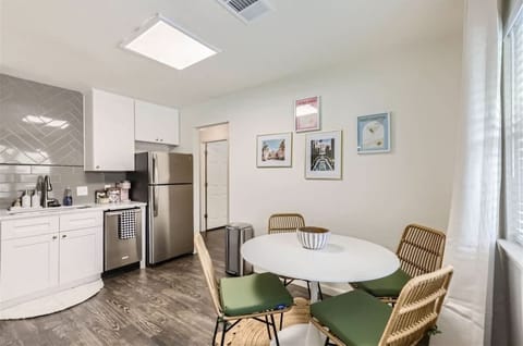 5. Open kitchen and dining area designed for both style and functionality. The modern kitchen features sleek appliances and ample counter space, while the dining area offers a perfect spot for family meals or entertaining.