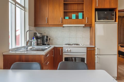 Comfort Apartment, City View | Private kitchen | Coffee/tea maker, electric kettle, toaster, dining tables