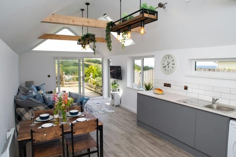 Open plan living area with patio doors leading to the deck