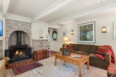 The upstairs living room has a wonderful wood burning fireplace for cozy evenings year round.