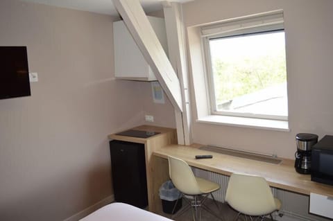 Desk, laptop workspace, free WiFi, bed sheets