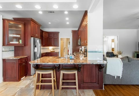 The kitchen provides ample counter space and modern appliances, making meal preparation a breeze.