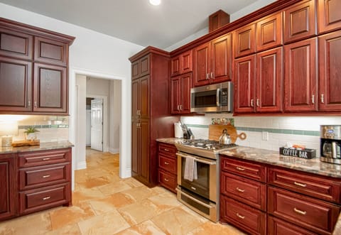 The stylish kitchen makes cooking easy and enjoyable, perfect for preparing delicious meals.