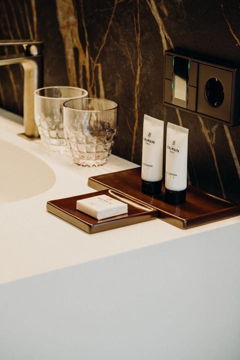 Shower, hair dryer, slippers, towels