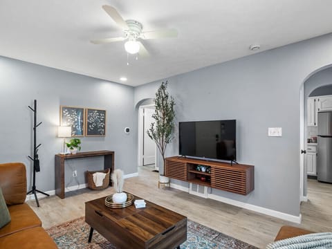 he bright and welcoming living room invites you to unwind.