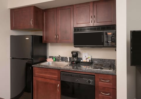 Suite, 1 Bedroom | Private kitchen | Full-size fridge, microwave, stovetop, dishwasher