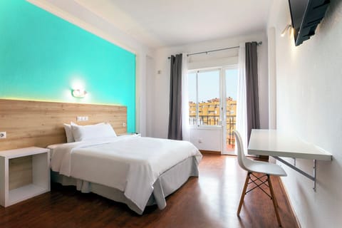 Desk, laptop workspace, blackout drapes, iron/ironing board