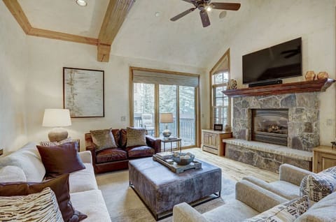 Unwind in the cozy living room, featuring plush seating, a flat-screen TV, and large windows that provide plenty of natural light and scenic views.