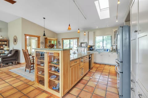 Fully equipped kitchen with high-end stainless steel appliances and ample counter space