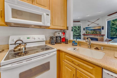 Kitchen: Well-equipped kitchen, range of appliances, spacious counter and cabinets, open layout to living and dining roomKitchen: Well-equipped kitchen, range of appliances, spacious counter and cabinets, open layout to living and dining room