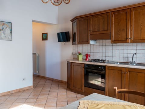 Fridge, toaster, cookware/dishes/utensils, dining tables