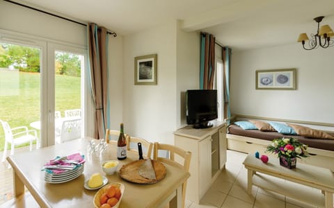 Loads of room at the dining table and the open concept is always nice for the cook.