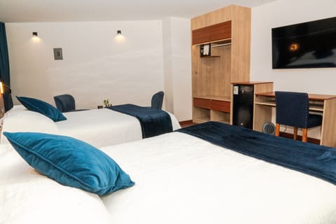 Deluxe Twin Room, Courtyard View | In-room safe, desk, laptop workspace, free WiFi