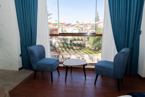 Deluxe Suite, Courtyard View | In-room safe, desk, laptop workspace, free WiFi