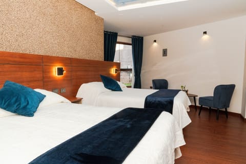 Deluxe Twin Room, Courtyard View | In-room safe, desk, laptop workspace, free WiFi