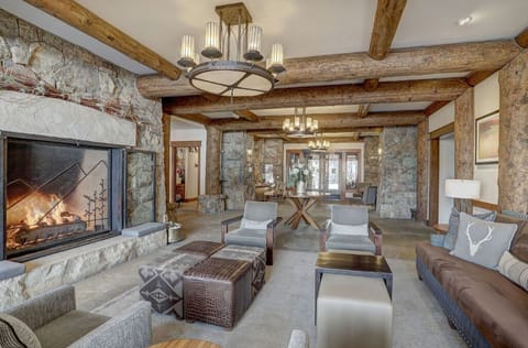 Relax in our luxurious living room, boasting fireplace, elegant decor, and comfortable seating. An inviting space for family and friends.