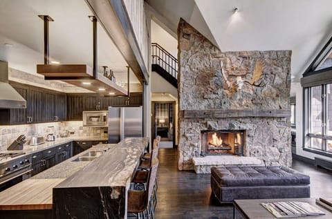 Cook in our gourmet kitchen, featuring an open-concept design, high-end appliances, and a large island. Perfect for culinary enthusiasts and socializing.