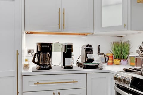 There is a fully stocked coffee and tea bar in the kitchen.