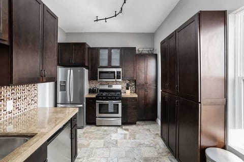 Kitchen is adorned with stainless steel appliances