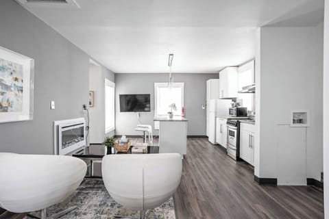 Our living room includes modern design, high-speed internet, and plush chairs!