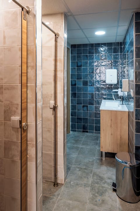 12 Mixed Dorm | Bathroom | Shower, hair dryer, soap, toilet paper