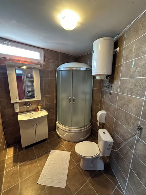 Deluxe Triple Room, River View | Bathroom | Shower, slippers, towels, soap