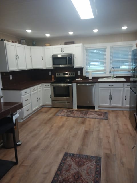 New kitcken with stainless appliances.. equipped for cooking and coffee bar