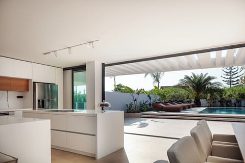 The seamless blend of contemporary design and natural beauty creates an atmosphere of pure relaxation and joy.