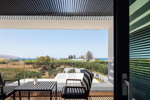 A private balcony overlooking the serene views of the natural landscape and sea.
