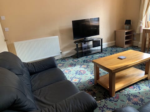 Apartment, 2 Bedrooms | Living area | 42-inch LCD TV with digital channels, books