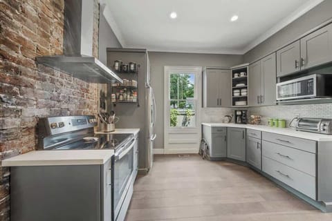 Abundant space, cookware, dishes, stainless steel appliances, and even a step ladder for your convenience.