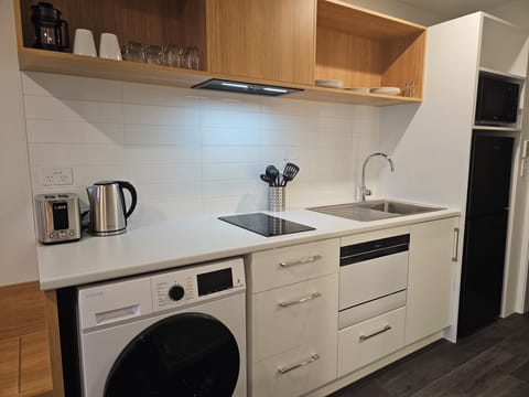 Premium Studio Twin Apartment | Private kitchen | Full-size fridge, microwave, stovetop, dishwasher