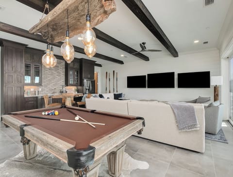 1st floor living room, pool table, multiple tvs