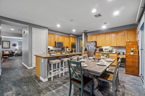 A spacious kitchen island and dining table, perfect for cooking and gathering!