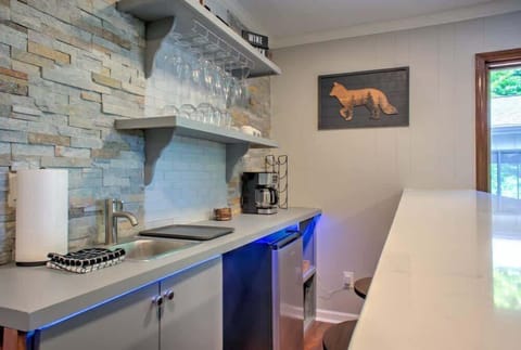 The game room features a pool table and a bar, providing a fantastic space for your whole group to unwind and have fun.