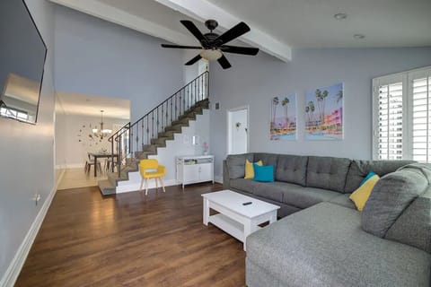 Living Room with 55" Roku TV.  Coffee table lifts into work space. 